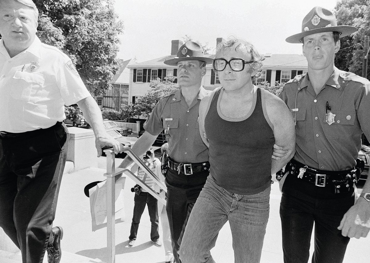 Myles Connor with police officers after being arrested in July 1985 AP Photo/Jim MacMillan
