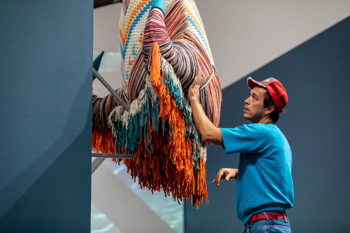 Cannupa Hanska Luger in the Joslyn's Temporary Exhibition Galleries
Photograph by Shayla Blatchford (Diné), 2025



